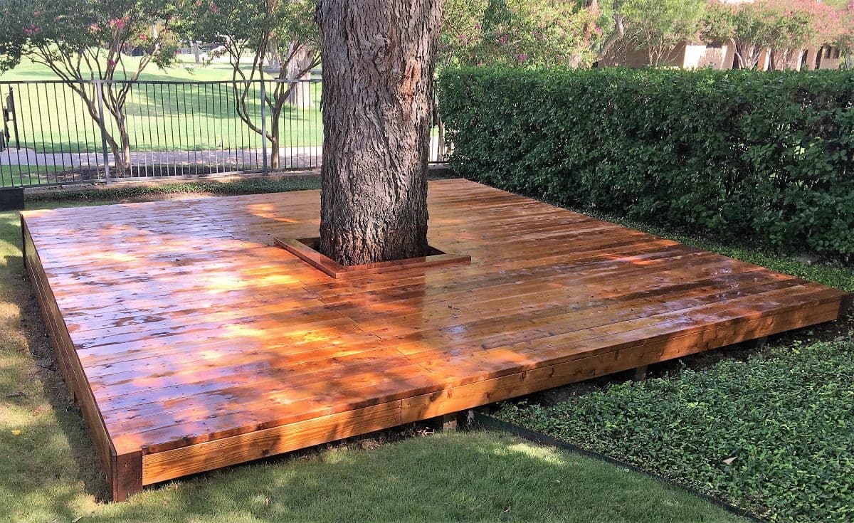 Custom deck wrapped around a tree — Master Decker